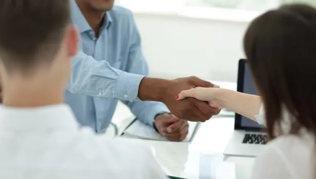 closeup.the handshake of employees in the workplace.the concept of cooperation